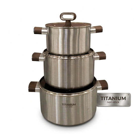 Three-piece stacked titanium non-stick cooking pot set with brushed stainless steel finish.