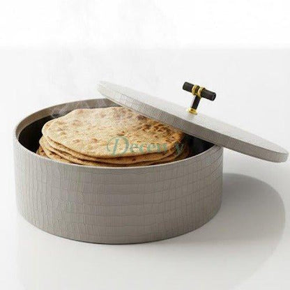 Traditional leather roti and chapati hotpot basket showcased on a wooden dining table.