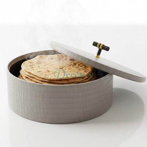 Traditional leather roti and chapati hotpot basket showcased on a wooden dining table.