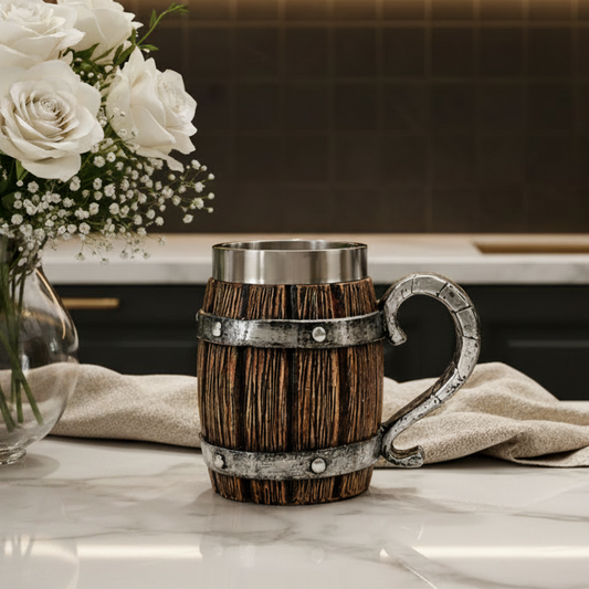 Viking wooden barrel mug 500ml with stainless steel lining sitting on a rustic table