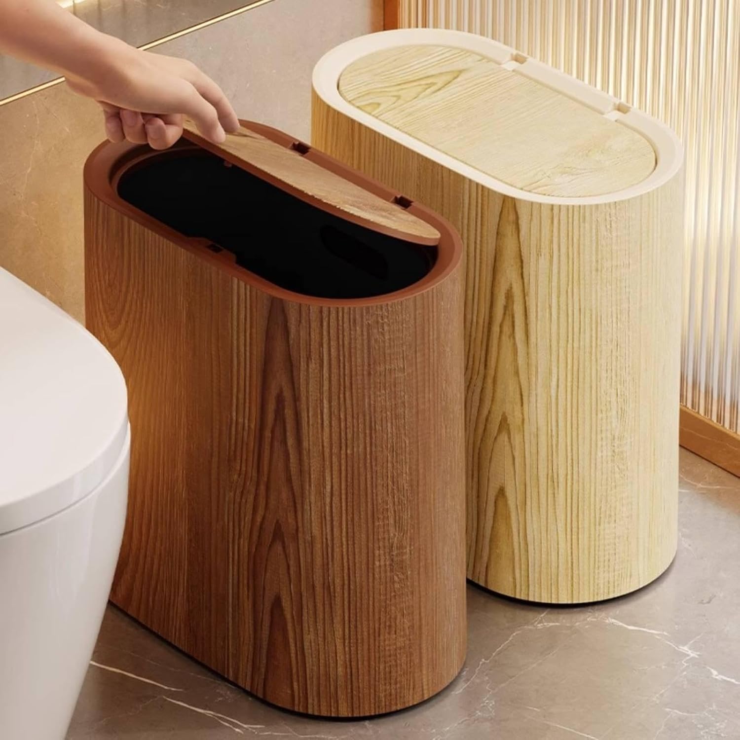 Dark and light wooden grain dustbins with press lid next to a modern toilet.