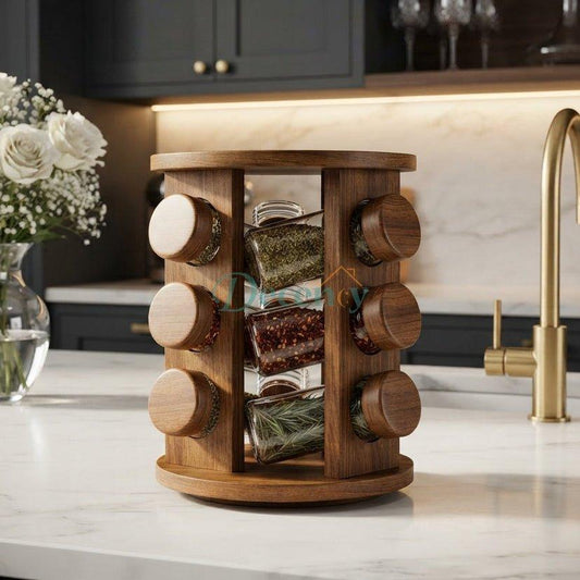 Wooden rotating spice rack organizer placed on a white marble countertop in a modern kitchen.   
