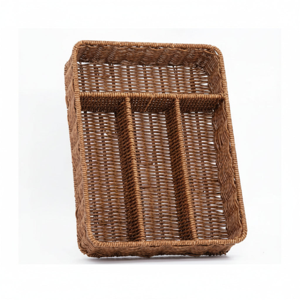 Woven rattan cutlery tray resting on a marble kitchen island countertop