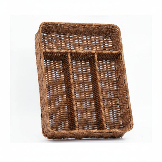 Woven rattan cutlery tray resting on a marble kitchen island countertop